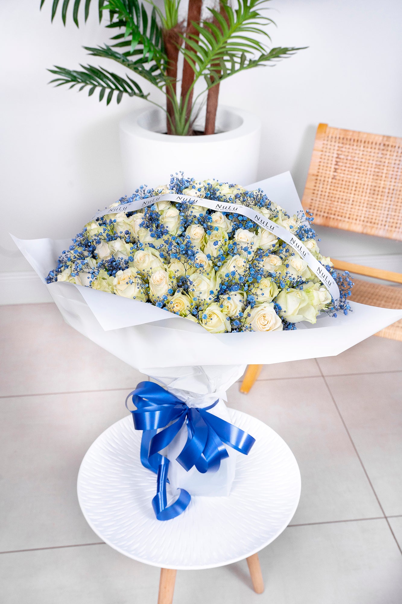 WHITE ROSES WITH BLUE GYP