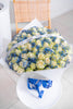 WHITE ROSES WITH BLUE GYP