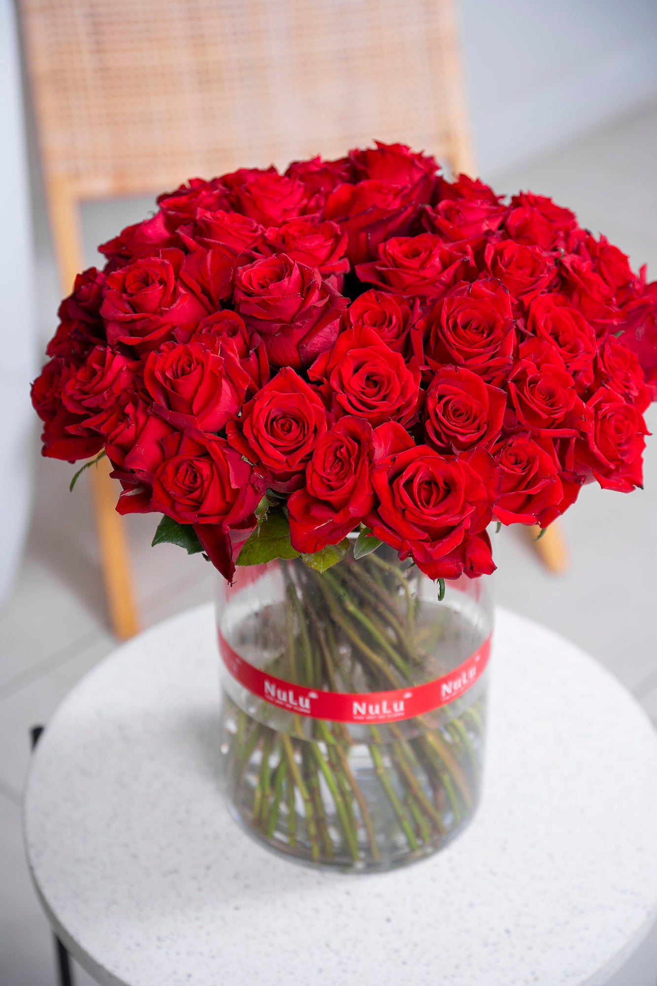 RED ROSES IN A VASE