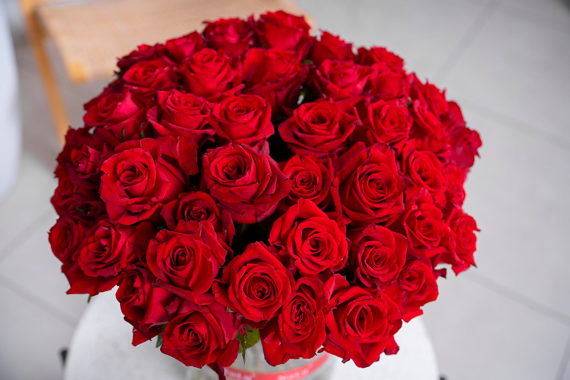 RED ROSES IN A VASE