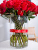 RED ROSES IN A VASE